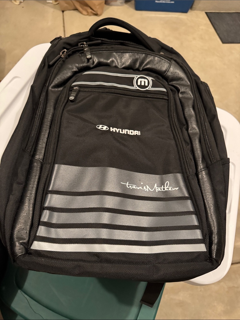 Travis Mathew Black Backpack with Silver Stripes